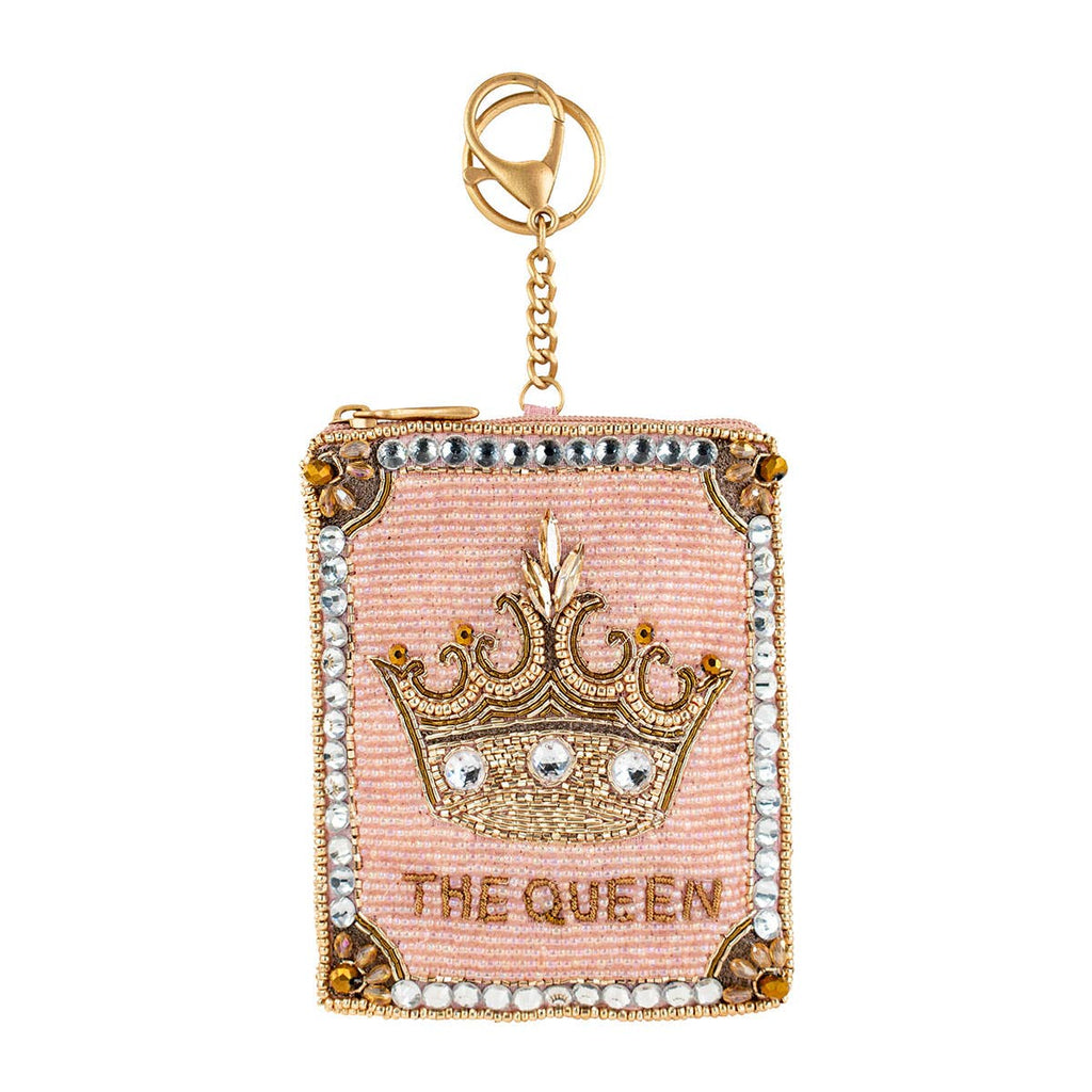 Decorative keychain with crown and 'The Queen' text on a pink background